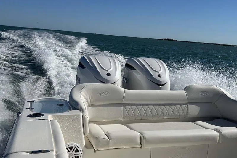 Slide: The Image of 2026 Key West 291 FS boat cruising on open water with twin engines. - 25