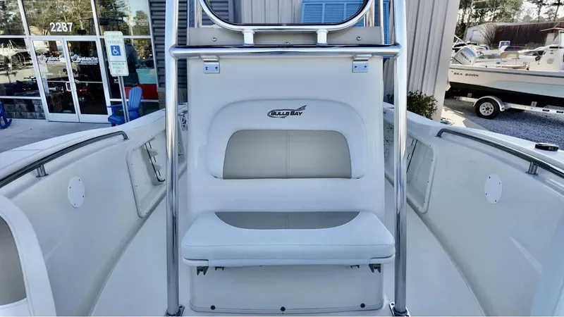 Slide: The Image of 2025 Bulls Bay 200CC boat interior with seating and console. - 12