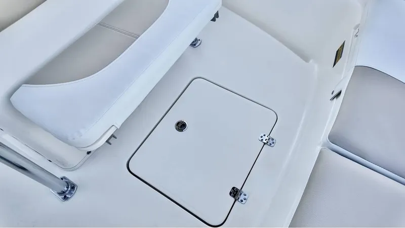 Slide: The Image of 2025 Bulls Bay 200CC boat interior with storage compartment and seating. - 14