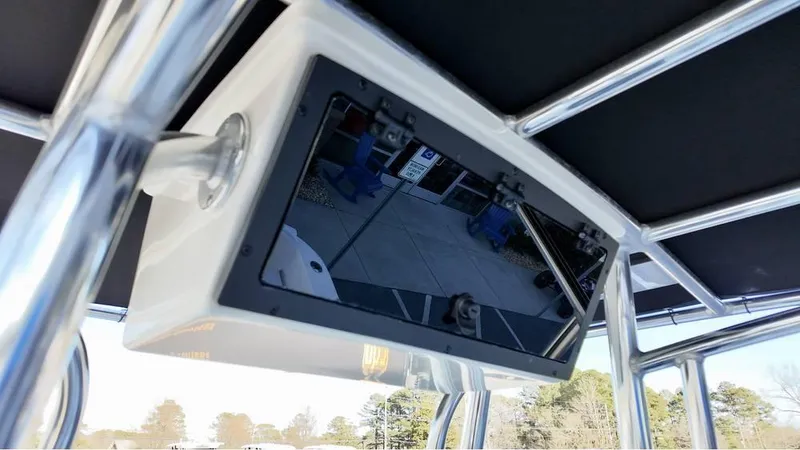 Slide: The Image of 2025 Bulls Bay 200CC boat with mounted electronic display under T-top. - 19