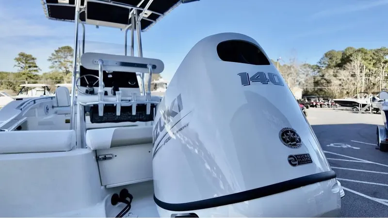 Slide: The Image of 2025 Bulls Bay 200CC boat with Suzuki 140 outboard motor in a parking lot. - 3