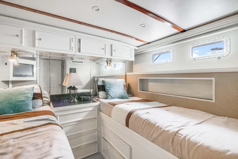 Slide: The Image of Interior of 1980 Hatteras 53 Motor Yacht with twin beds and elegant decor. - 16