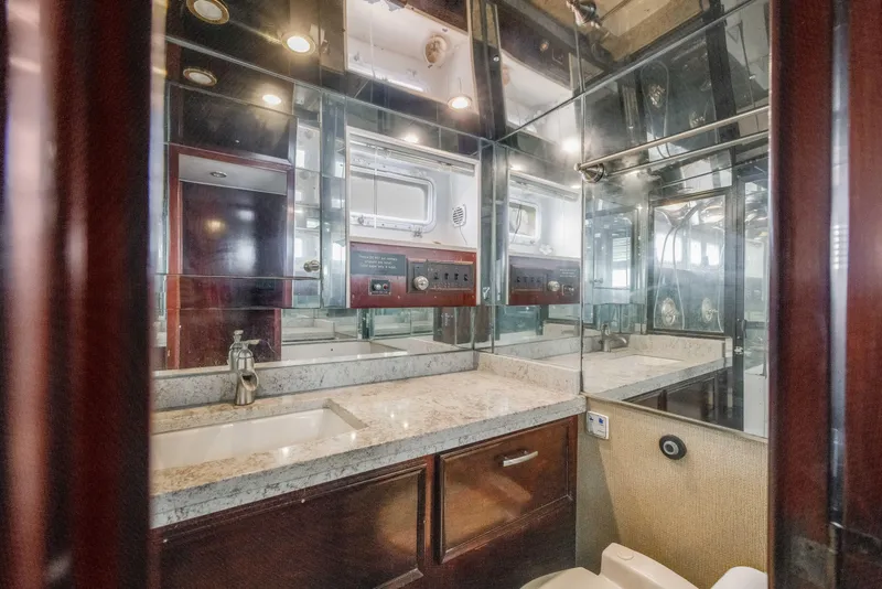 Slide: The Image of Luxurious bathroom interior of 1980 Hatteras 53 Motor Yacht with mirrored walls and modern fixtures. - 32