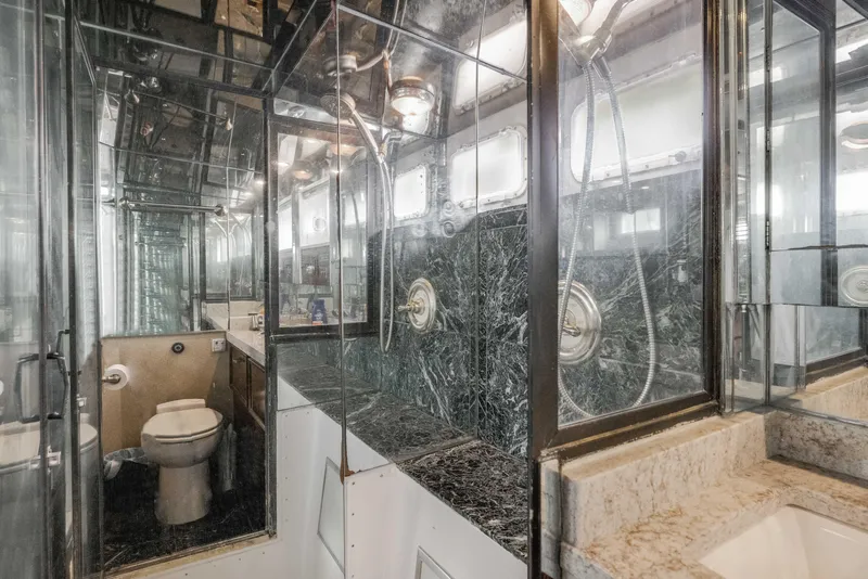 Slide: The Image of Luxurious bathroom in 1980 Hatteras 53 Motor Yacht with marble and mirrored surfaces. - 34