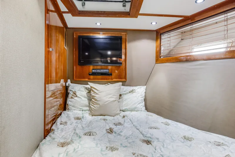 Slide: The Image of Cozy bedroom in 1980 Hatteras 53 Motor Yacht with TV and wood accents. - 45