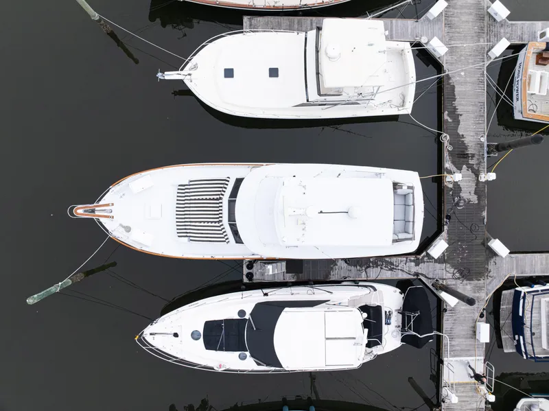 Slide: The Image of Aerial view of a 1980 Hatteras 53 Motor Yacht docked at a marina. - 6