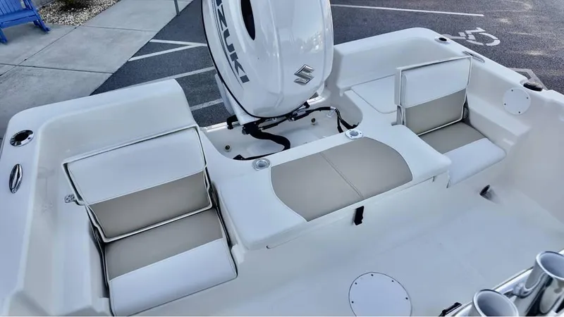 Slide: The Image of 2025 Bulls Bay 2200 XS boat interior with seating and Suzuki engine. - 10