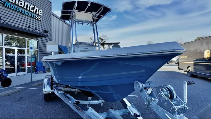 Slide: The Image of 2025 Bulls Bay 2200 XS boat on trailer outside dealership. - 3