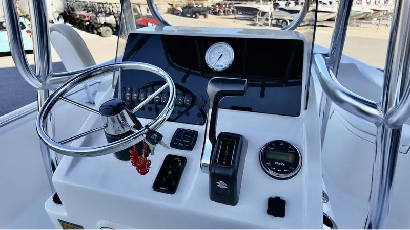 Slide: The Image of Bulls Bay 2200 XS 2025 boat console with steering wheel and controls. - 9