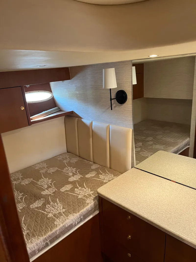 Slide: The Image of Interior cabin of 1998 Ocean Yachts 48 Express with bed and mirror. - 12