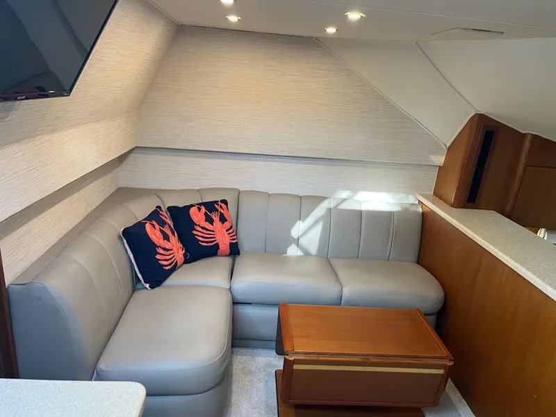Slide: The Image of Luxurious 1998 Ocean Yachts 48 Express interior with leather seating and nautical decor. - 7
