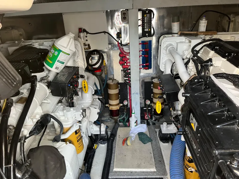 Slide: The Image of Engine room of a 1998 Ocean Yachts 48 Express, showcasing mechanical components and equipment. - 9