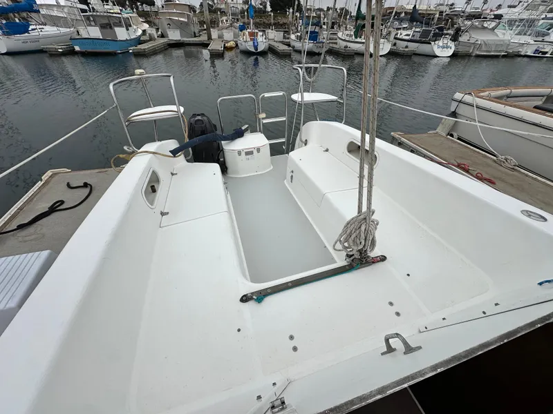 Slide: The Image of Open cockpit of a 2005 Catalina 250 MkII sailboat docked at a marina. - 14