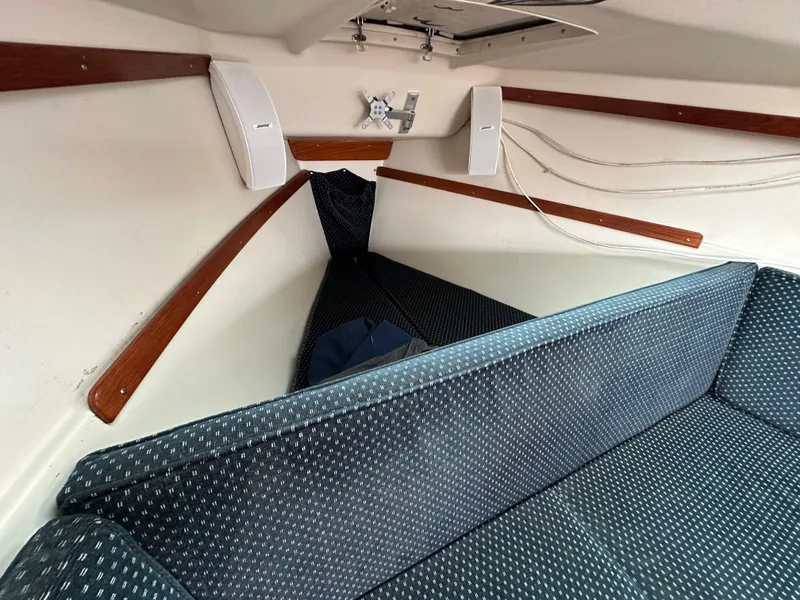 Slide: The Image of Interior cabin of a 2005 Catalina 250 MkII sailboat with cushioned seating. - 9