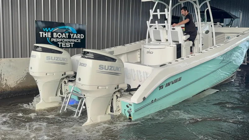 Slide: The Image of 2021 Twin Vee 310 GF boat with Suzuki engines during performance test at The Boat Yard. - 13