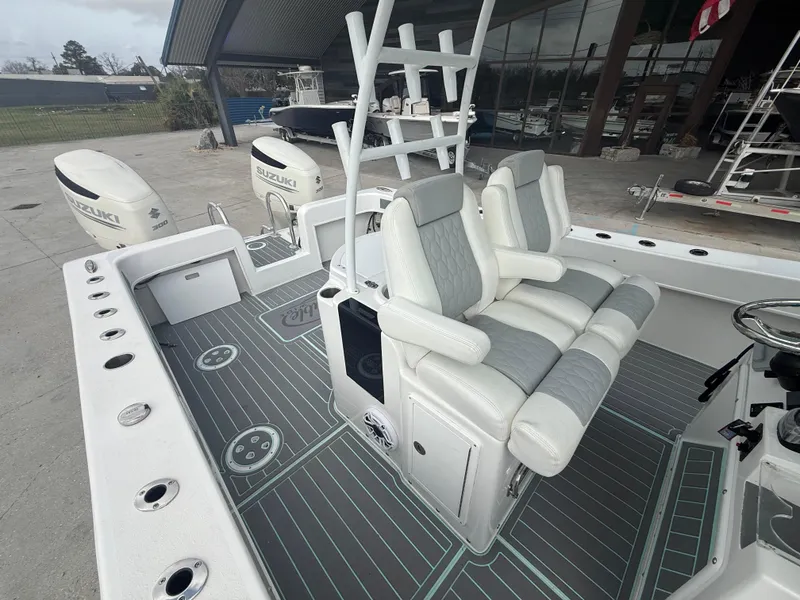 Slide: The Image of 2021 Twin Vee 310 GF boat with dual engines and cushioned seating. - 14