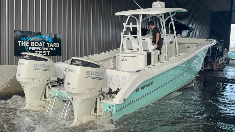 Slide: The Image of 2021 Twin Vee 310 GF boat with Suzuki engines during performance test at The Boat Yard. - 2