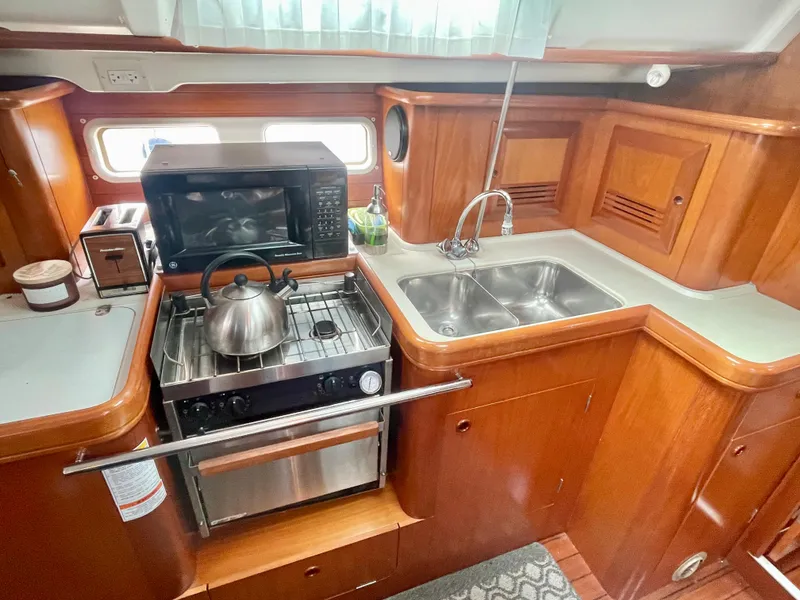 Slide: The Image of Galley with stove and oven - 28