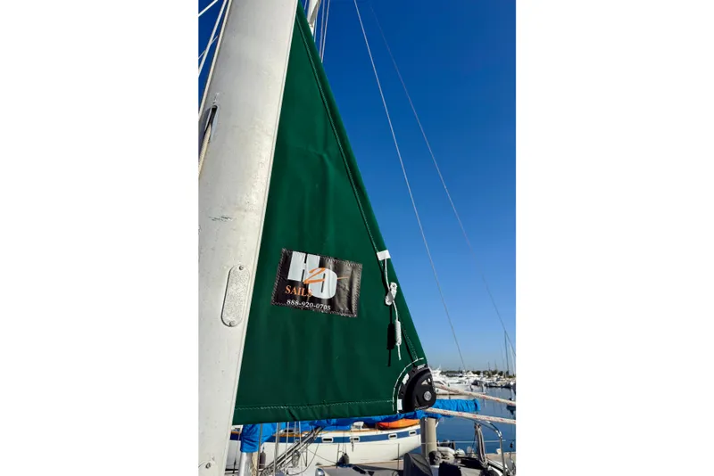 Slide: The Image of Green sail on a 2001 Beneteau 411 yacht against a clear blue sky. - 13