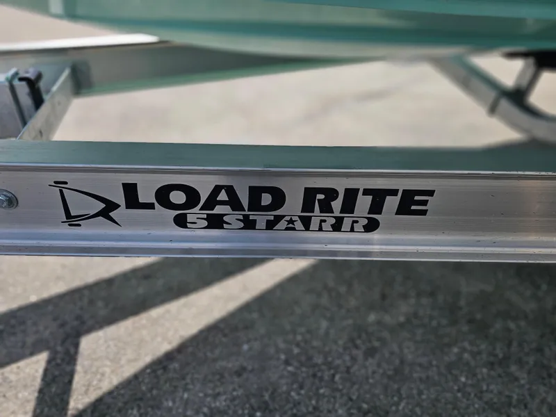 Slide: The Image of Load Rite 5 Starr trailer for Savannah 210X, 2025 model, on pavement. - 13