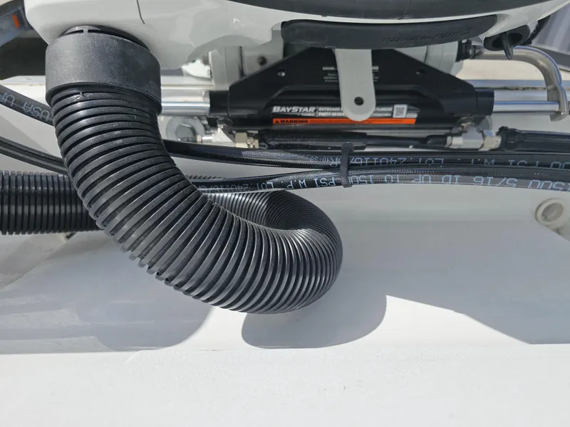 Slide: The Image of Close-up of Savannah 210X 2025 boat engine components and hoses. - 29
