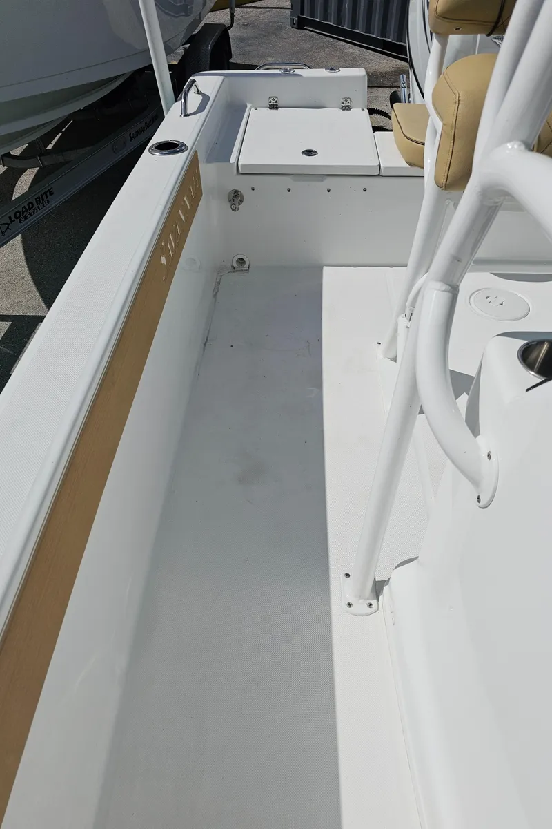 Slide: The Image of 2025 Savannah 210X boat interior with white deck and seating. - 34