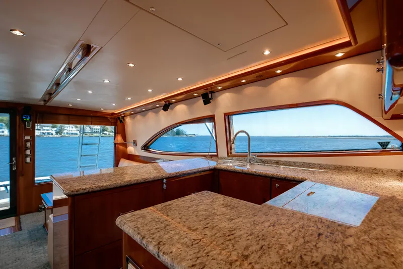 Slide: The Image of Luxurious interior of 2007 Bertram 570 Convertible yacht with ocean view through large windows. - 29