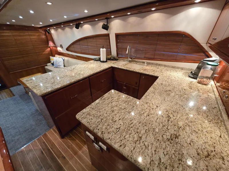 Slide: The Image of Luxurious kitchen interior of 2007 Bertram 570 Convertible yacht with granite countertops. - 33