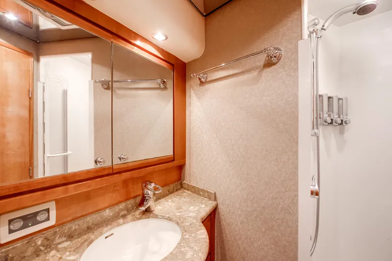 Slide: The Image of Luxurious bathroom in 2007 Bertram 570 Convertible yacht with modern fixtures and elegant design. - 36