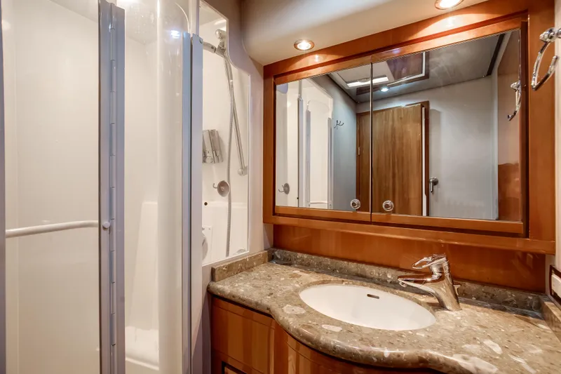 Slide: The Image of Luxurious bathroom in 2007 Bertram 570 Convertible yacht with modern fixtures and elegant design. - 37