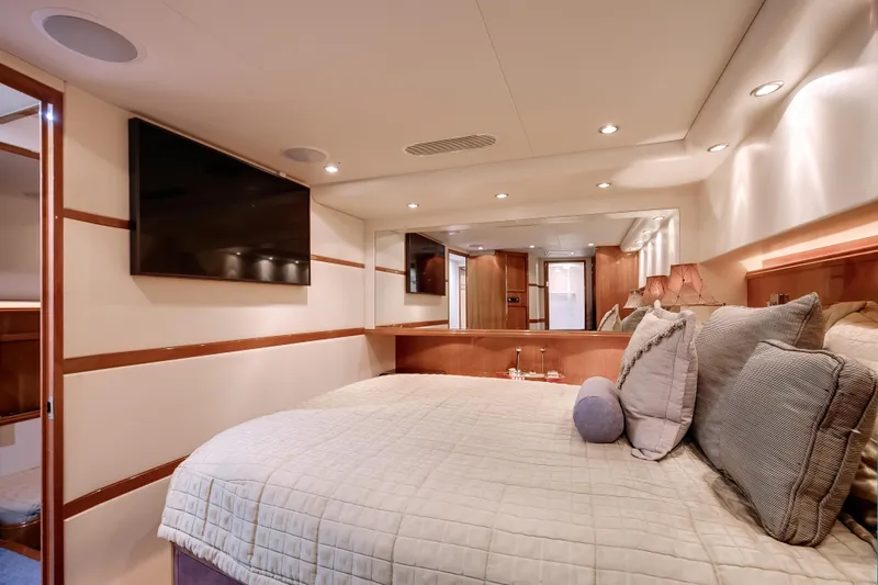 Slide: The Image of Luxurious bedroom interior of 2007 Bertram 570 Convertible yacht with modern amenities. - 41