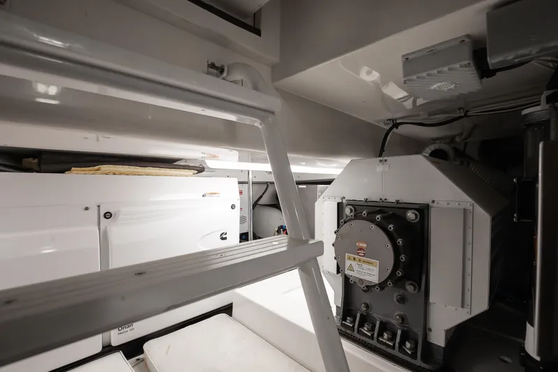 Slide: The Image of Engine room of a 2007 Bertram 570 Convertible yacht, featuring machinery and equipment. - 46