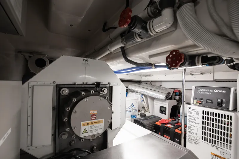 Slide: The Image of Engine room of 2007 Bertram 570 Convertible with Cummins Onan generator and mechanical components. - 47