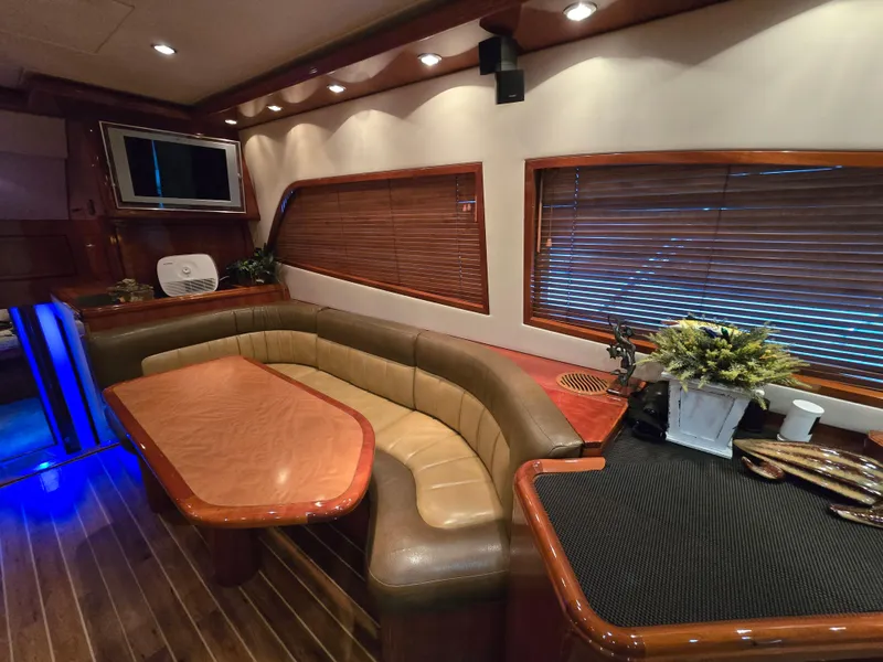 Slide: The Image of 2007 Bertram 570 Convertible yacht on open water under clear blue sky. - 5