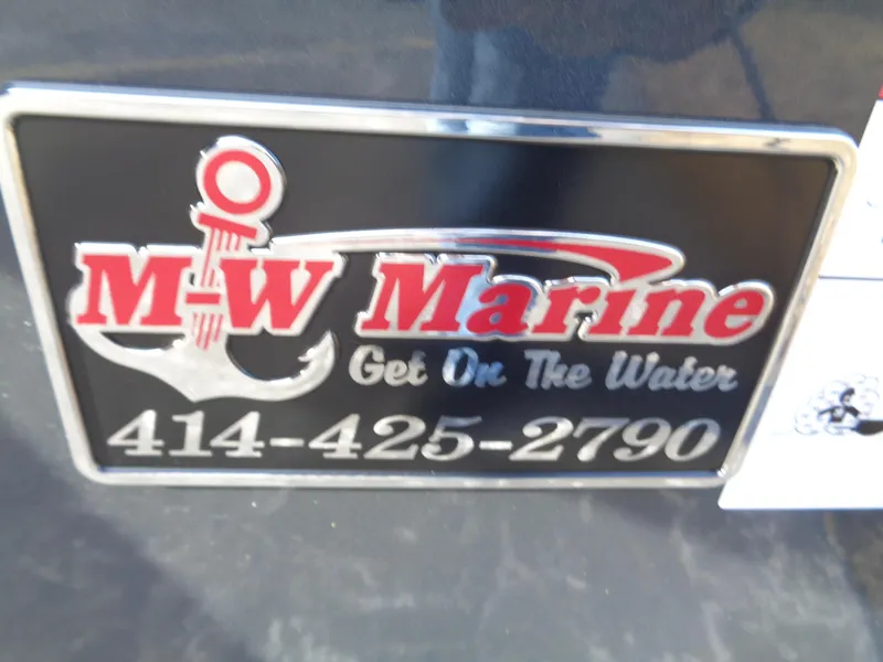 Slide: The Image of Sign for M-W Marine with anchor logo and contact number. - 14