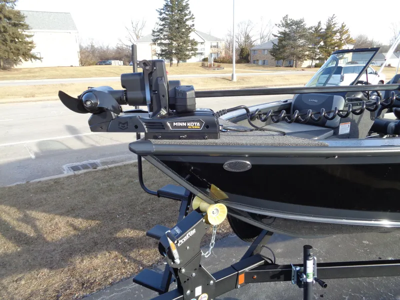 Slide: The Image of 2025 Lund 1875 Crossover XS boat with Minn Kota trolling motor on trailer. - 5