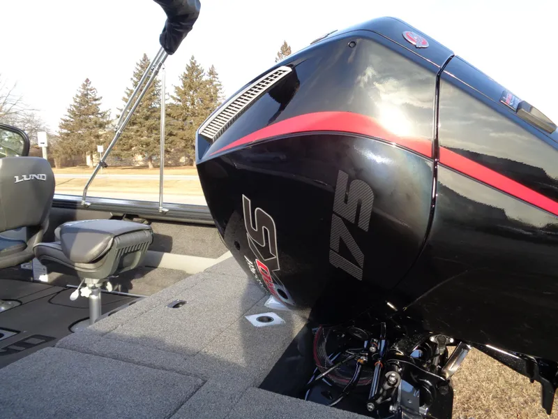 Slide: The Image of 2025 Lund 1875 Crossover XS boat with powerful 175 HP engine, featuring sleek design. - 6