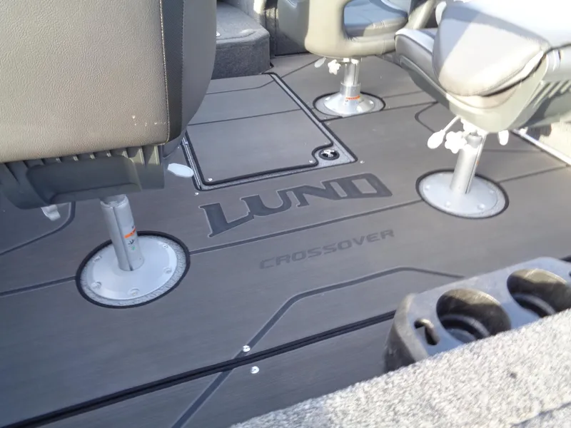 Slide: The Image of 2025 Lund 1875 Crossover XS boat interior with seating and floor design. - 9