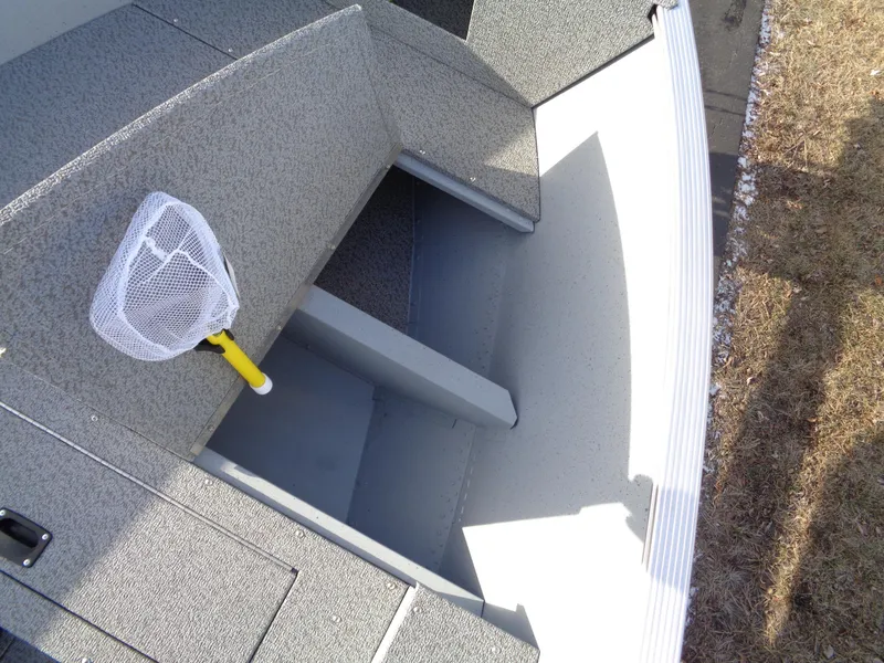 Slide: The Image of 2025 Lund 1600 Fury Heritage boat interior with fishing net on seat. - 12