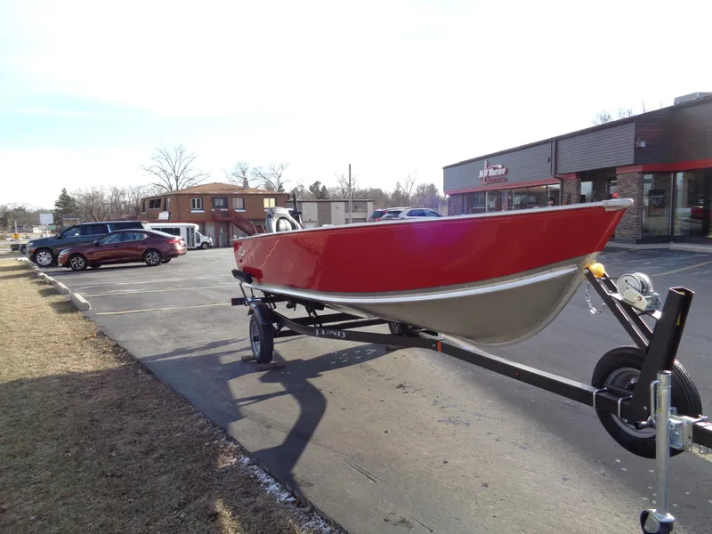 Slide: The Image of 2025 Lund 1600 Fury Heritage boat on trailer in parking lot. - 3