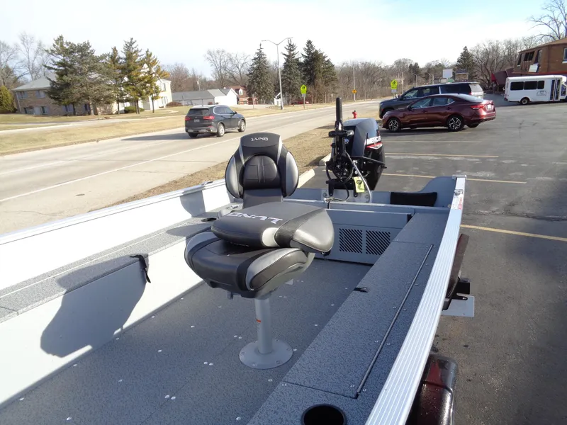 Slide: The Image of 2025 Lund 1600 Fury Heritage boat with seating, parked in a lot. - 9