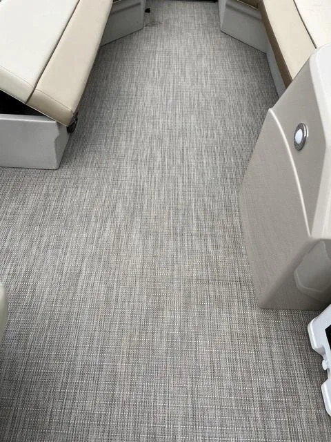 Slide: The Image of 2025 Veranda VISTA VIEW 22RC boat interior with beige seating and textured flooring. - 13