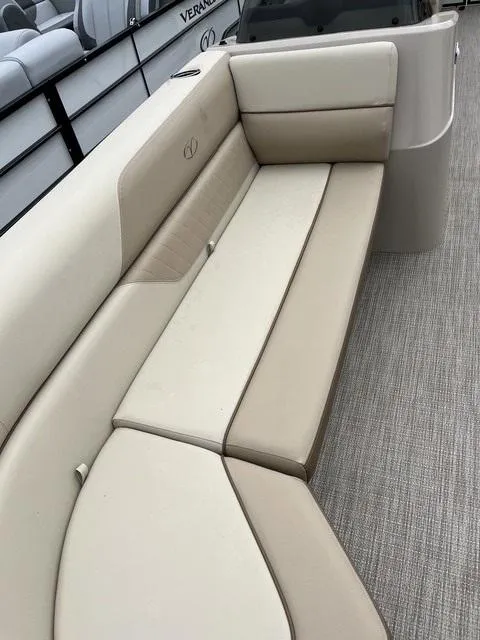 Slide: The Image of 2025 Veranda VISTA VIEW 22RC boat with beige seating and carpeted flooring. - 7