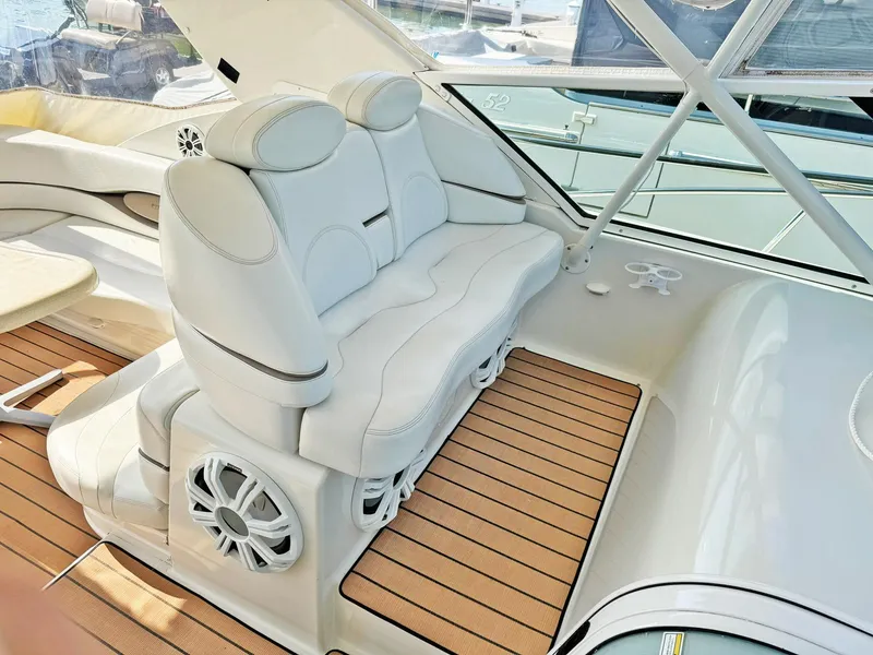 Slide: The Image of Luxurious seating on 1998 Trojan 440 Express yacht with teak flooring. - 17