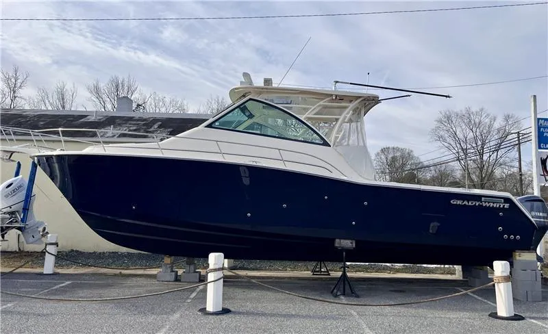 Slide: The Image of 2015 Grady-White Express 370 boat displayed on land, side view. - 0