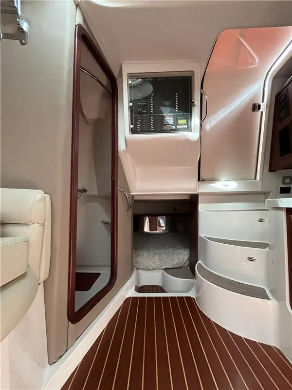 Slide: The Image of 2015 Grady-White Express 370 cabin interior with wood flooring and modern design. - 17