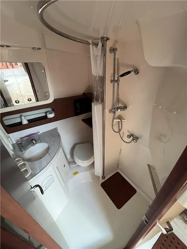 Slide: The Image of 2015 Grady-White Express 370 bathroom with shower, sink, and toilet. - 18