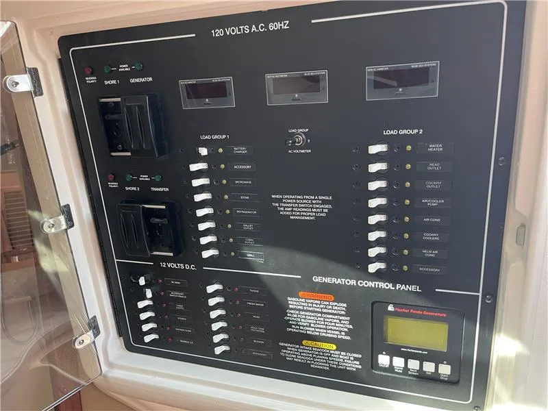 Slide: The Image of Electrical control panel on a 2015 Grady-White Express 370 boat. - 19