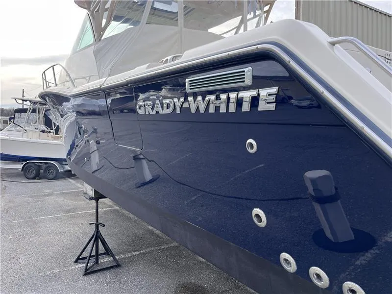 Slide: The Image of 2015 Grady-White Express 370 boat on display, showcasing sleek design and branding. - 3