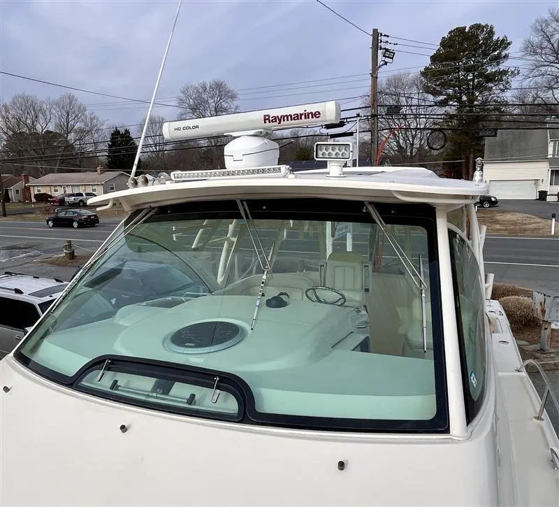 Slide: The Image of 2015 Grady-White Express 370 boat with Raymarine radar, docked in a residential area. - 7